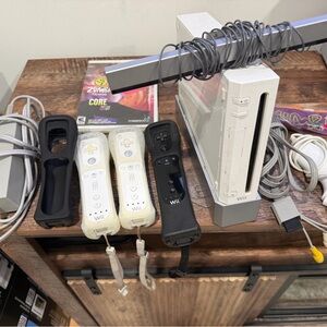 Nintendo Wii Console with White and Black Controllers